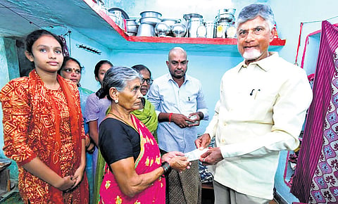 CM Nara Chandrababu Naidu handing over the pension amount to an old woman during the Pedala Sevalo programme at Datti in Vizianagaram district