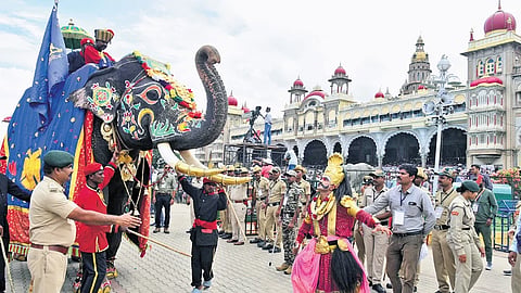 Folk artistes perform in front of elephant Abhimanyu