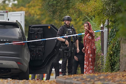 Emergency service workers at the scene of a stabbing incident at Heaton Park Hebrew Congregation synagogue, in Crumpsall, Manchester, England, Thursday, Oct. 2, 2025.