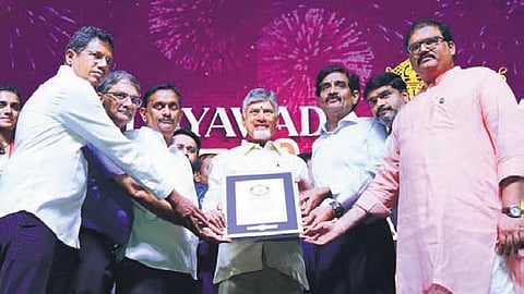 Chief Minister Chandrababu Naidu receives the certificate for Dasara Carnival from Guinness Book of Records adjudicator; artistes perform a variety of folk art forms during the event in Vijayawada