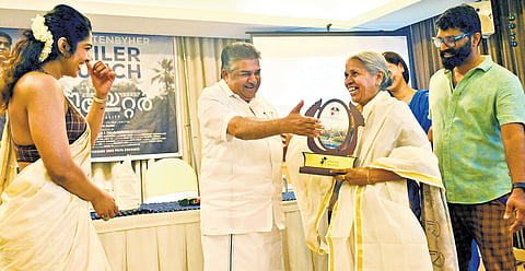 Culture and Youth Affairs Minister Saji Cherian felicitates Radhamani Amma, who holds driving licences for 11 types of vehicles, at the #UnwrittenByHer event celebrating women who carved unique paths in Thiruvananthapuram on Friday