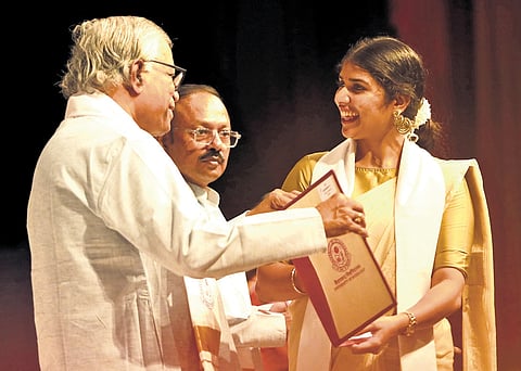 A student receives her degree during the 25th convocation of the UoH at the
Global Peace Auditorium in Gachibowli on Tuesday