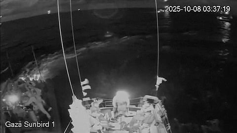 This image obtained from live stream footage from the Sumud Flotilla's Gaza Sunbird 1 vessel shows Israeli forces approaching in boats in the Eastern Mediterranean Sea on Wednesday, Oct. 8, 2025.