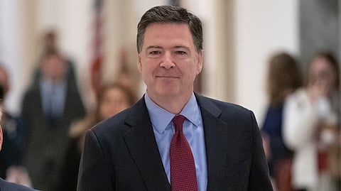 Former FBI Director James Comey arrives to testify under subpoena behind closed doors before the House Judiciary and Oversight Committee on Capitol Hill in Washington, Dec. 7, 2018.