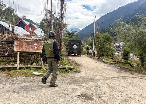 A security officer during a search operation to track down terrorists, at Kokernag in Anantnag district, Jammu and Kashmir, Wednesday, Oct. 8, 2025.