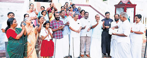 Munambam residents celebrate the HC verdict by sharing sweets on the premises of Kadappuram Velankanni Matha Church
