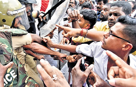 Police block BJP workers during a protest march to Pathanamthitta Mini Civil Station on Friday, demanding the arrest of the culprits in the Sabarimala
gold-plating case