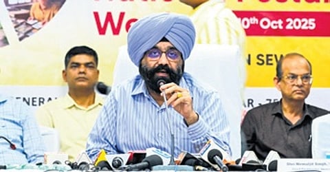 Chief Postmaster General Nirmaljit Singh speaks to the media during a press meet in Bhubaneswar