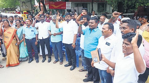 Family members of V Dinesh Kumar (inset) and activists staging a protest in front of collector office for the second consecutive day in Madurai