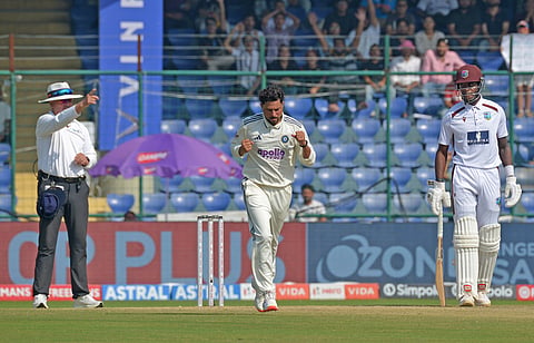 India's Kuldeep Yadav (C) celebrates his wicket on Day 3 of the second Test against West Indies, in New Delhi on Sunday