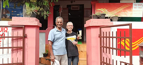 Haim Aharon pose for a photograph with his wife Noga outside the Mala Post Office, which was once his home. Picture is from his last visit to Kerala; in December 2022
