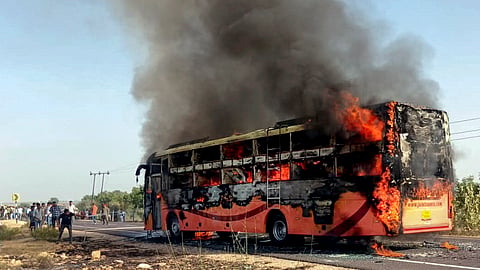 A bus traveling from Jaisalmer to Jodhpur catches fire, near Thaiyat village in Jaisalmer district, Rajasthan, Tuesday, Oct. 14, 2025.