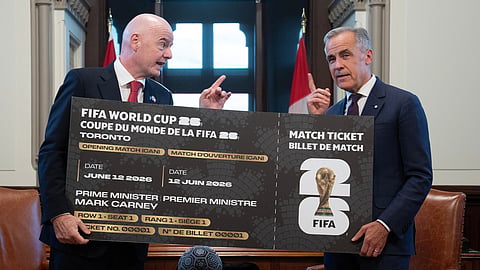 Canada Prime Minister Mark Carney, right, is presented with a novelty World Cup ticket by FIFA President Gianni Infantino on Parliament Hill in Ottawa, Ontario, Friday, Oct. 10, 2025.