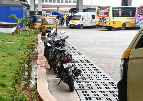 Vehicles parked illegally on the premises of the Panjappur bus terminus.