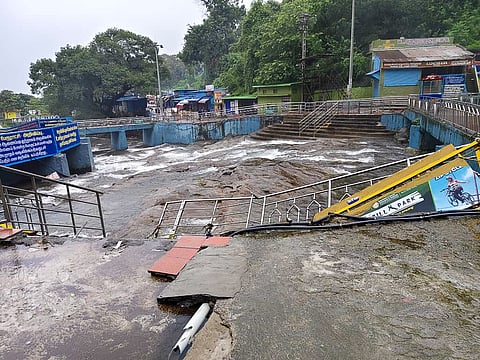 Strong currents caused structural damage, washing away handrails and platforms, at the Main Courtallam Falls on Tuesday;