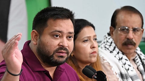 RJD leader and Leader of Opposition in Bihar Assembly Tejashwi Yadav addresses a press conference ahead of the state Assembly elections, in Patna, Wednesday, Oct. 22, 2025.