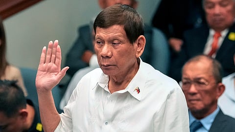Former Philippine President Rodrigo Duterte takes an oath during a Senate inquiry on the so-called war on drugs during his administration at the Philippine Senate on Oct. 28, 2024, in Manila, Philippines.