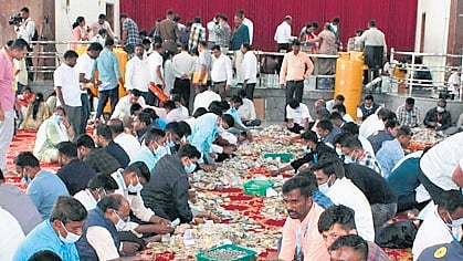 Revenue officials count the cash collected in hundi of Goddess Hasanamba in Hassan on Friday
