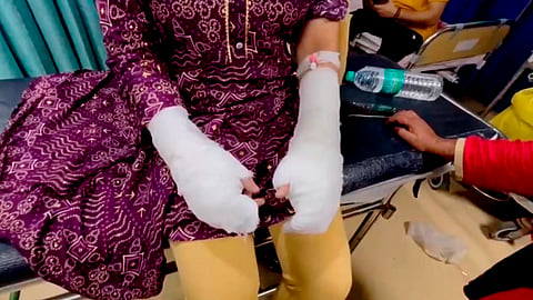 The 20-year-old woman being treated at a hospital after sustaining burn injuries on her hands.