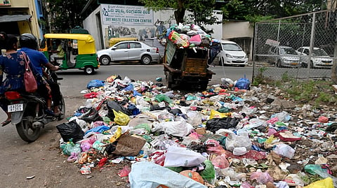 Garbage scattered on the road in front of the dry waste collection centre at Nanjamba Agrahara, Chamrajpet in Bengaluru.