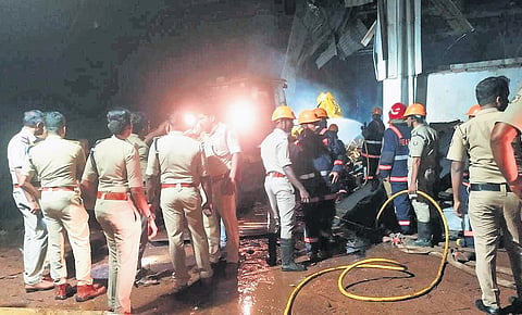 Fire and Rescue Services officials at the plywood factory in Kasaragod, where a boiler exploded on Monday