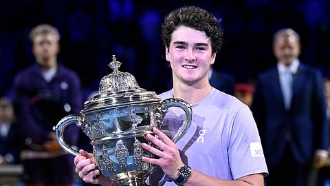 Brazil's Joao Fonseca poses with the trophy after winning the final match against Spain's Alejandro Davidovich Fokina at the Swiss Indoors tennis tournament in Basel, Switzerland, Sunday, Oct. 26, 2025.