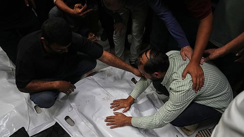 The bodies of Palestinians killed in an Israeli army strike are brought to Nasser Hospital in Khan Younis, Gaza Strip, Tuesday, Oct. 28, 2025