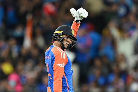 India's Abhishek Sharma celebrates making 50 runs against Australia during their T20 cricket match in Melbourne, Australia, Friday, Oct. 31, 2025.