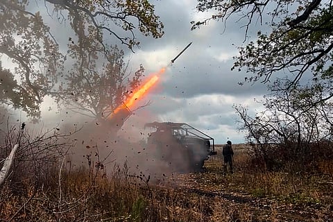 In this file photo made from video provided by the Russian Defense Ministry Press Service on Friday, Oct. 31, 2025, a Russian "Grad" self-propelled 122 mm multiple rocket launcher fires towards Ukrainian positions on an undisclosed location in Ukraine.