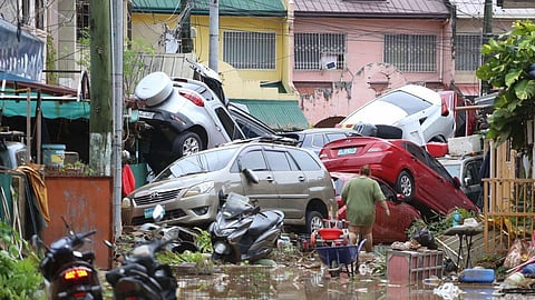 Vehicles lie piled on after flooding caused by Typhoon Kalmaegi in Cebu city, central Philippines, Tuesday, Nov. 4, 2025.