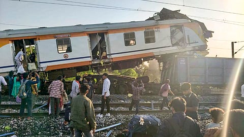 People gather after a passenger train collided with a goods train near Bilaspur railway station, Chhattisgarh, Tuesday, Nov. 4, 2025