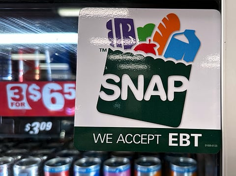 SNAP EBT information sign is displayed at a gas station in Riverwoods, Ill., Saturday, Nov. 1, 2025.