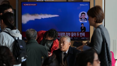 A TV screen shows a reporting of North Korea's ballistic missiles with file footage during a news program at the Seoul Railway Station in Seoul, South Korea, Friday, Nov. 7, 2025.