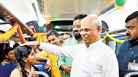 Governor Rajendra Arlekar and Union Minister Suresh Gopi interact with students on board the Vande Bharat