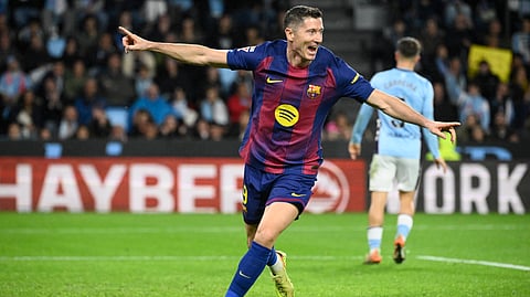 Barcelona's Robert Lewandowski celebrates his second goal during the Spanish league football match between RC Celta de Vigo and FC Barcelona at Balaidos Stadium in Vigo on November 9, 2025.