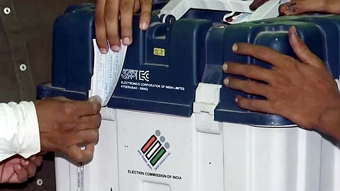 Polling officials seal the EVMs after voting ends for the first phase of the Bihar assembly election in Darbhanga, Nov. 06, 2025.