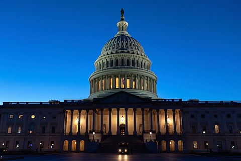 The U.S. Capitol is seen on a sunset a day before the House prepares to vote on a bill to reopen the government at the Capitol in Washington, Tuesday, Nov. 11, 2025.