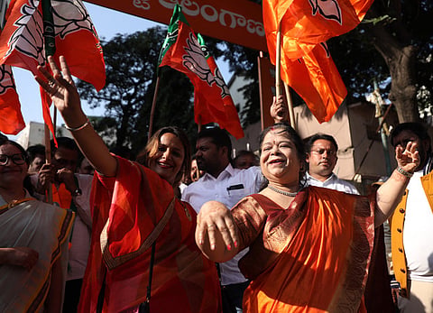 BJP party members celebrate the NDA's victory in the Bihar Elections at Patna