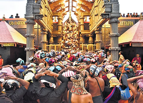 A rush of devotees was seen in front of the holy steps at the Sabarimala temple when it was opened for the Mandala-Makaravilakku season on Monday