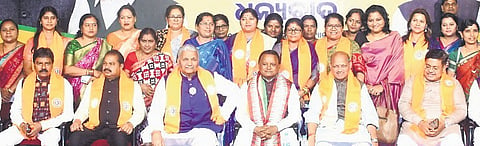 CM Mohan Majhi, flanked by Vijay Pal Singh Tomar and Manmohan Samal, at the thanksgiving ceremony for party workers in Bhubaneswar on Monday
