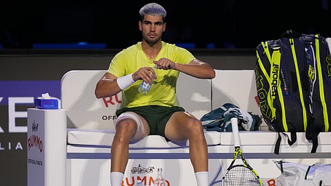 Spain's Carlos Alcaraz sits between the games during the final tennis match of the ATP World Tour Finals against Italy's Jannik Sinner, in Turin, Italy, Sunday, Nov. 16, 2025.