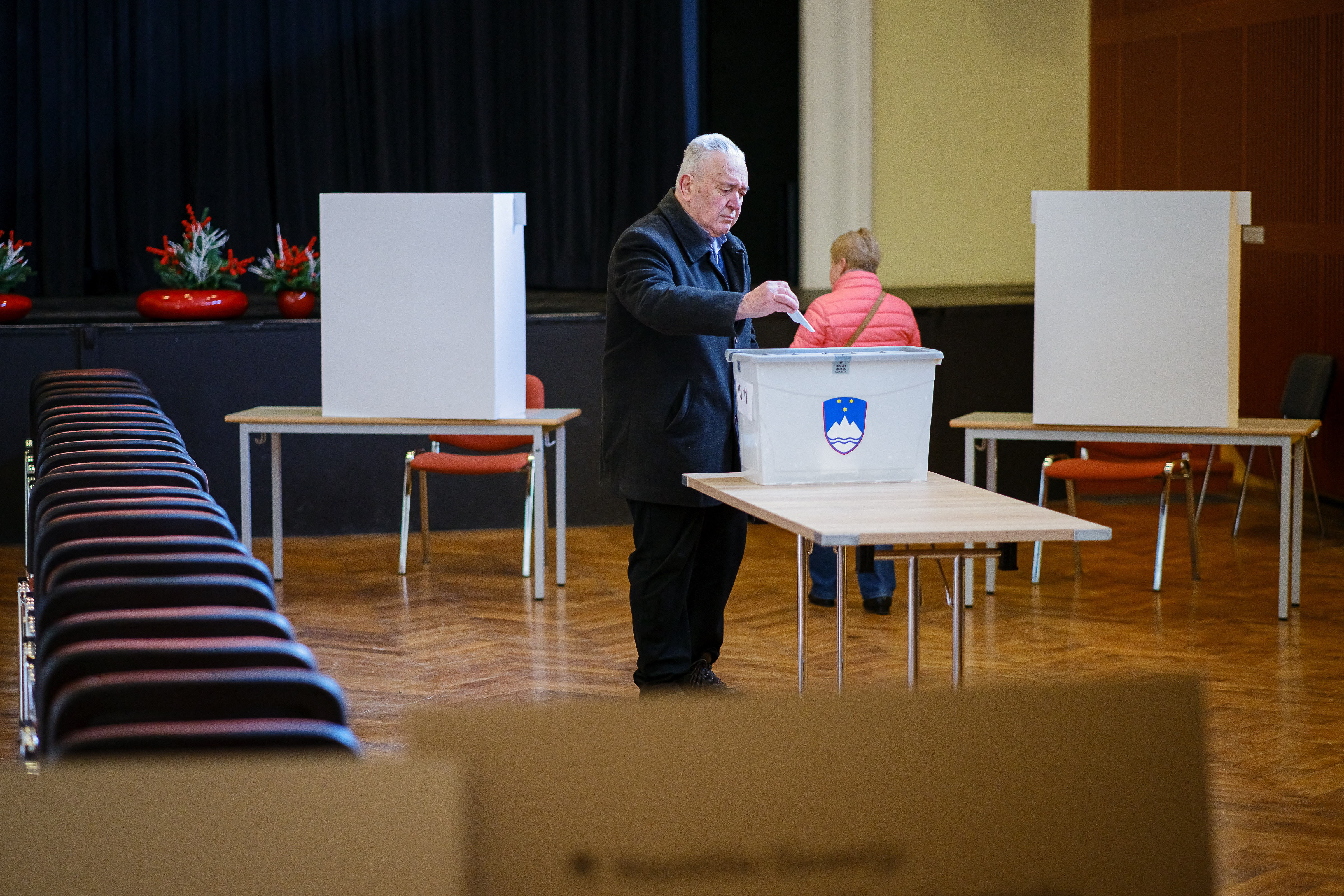 A voter casts his ballot for a referendum that will determine if a law legalising assisted dying will be enforced or suspended at a polling station in Radomlje, on November 23, 2025.
