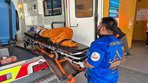 In this Sunday, Nov. 23, 2025, photo, an emergency rescue team transports an elderly woman discovered to still be alive after being considered deceased to a local hospital before her scheduled cremation at Wat Rat Prakhong Tham temple, Nonthaburi province, Thailand.