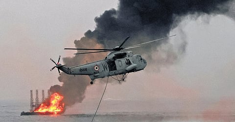 Navy personnel stage a high-intensity rescue and combat drill off Shankhumukham beach in Thiruvananthapuram on Friday, as part of rehearsals for the Navy Day celebrations scheduled for December 3