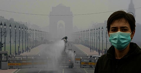 An anti-smog gun being used to spray water droplets to curb air pollution, at Kartavya Path in New Delhi.