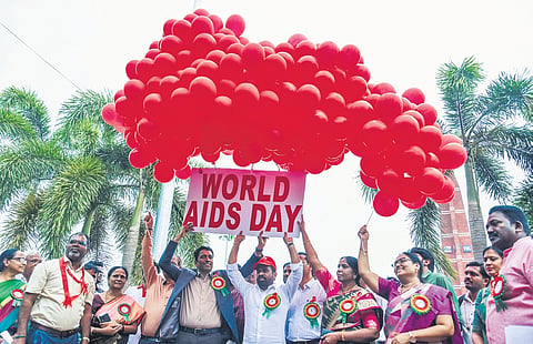 Health Minister Satya Kumar Yadav takes part in the World AIDS Day event at Tummalapalli Kalashetram in Vijayawada on Monday