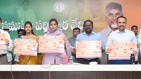 Guntur district collector Thameem Ansaria releses job fair flyer on Monday.