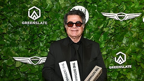 Jafar Panahi poses with the awards for best international feature, best original screenplay and best director at The Gotham Film Awards at Cipriani Wall Streeton Monday, Dec 1, 2025, in New York.