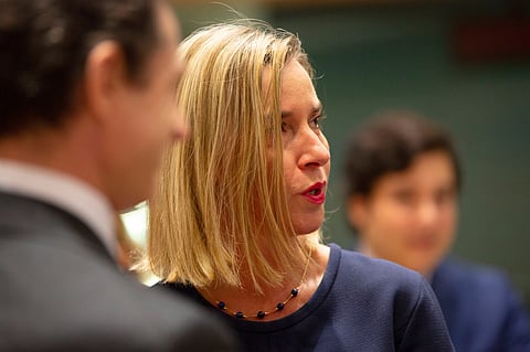 European Union foreign policy chief Federica Mogherini, right, attends a meeting of EU foreign ministers at the EU Council building in Brussels, Nov. 25, 2019.