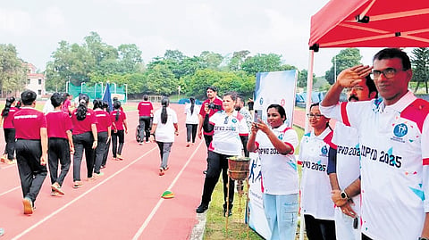 Dr Selvan P, president, IAPMR-Kerala, salutes the children participating in the march past during the special sports meet held at Lakshmibai National College of Physical Education in Thiruvananthapuram